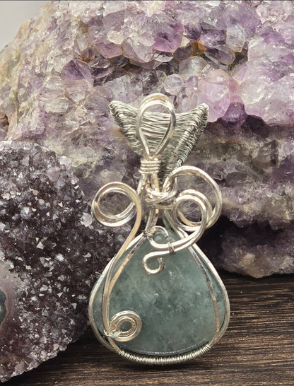 Aquamarine Pendant Wrapped In Silver-Plated Copper Wire