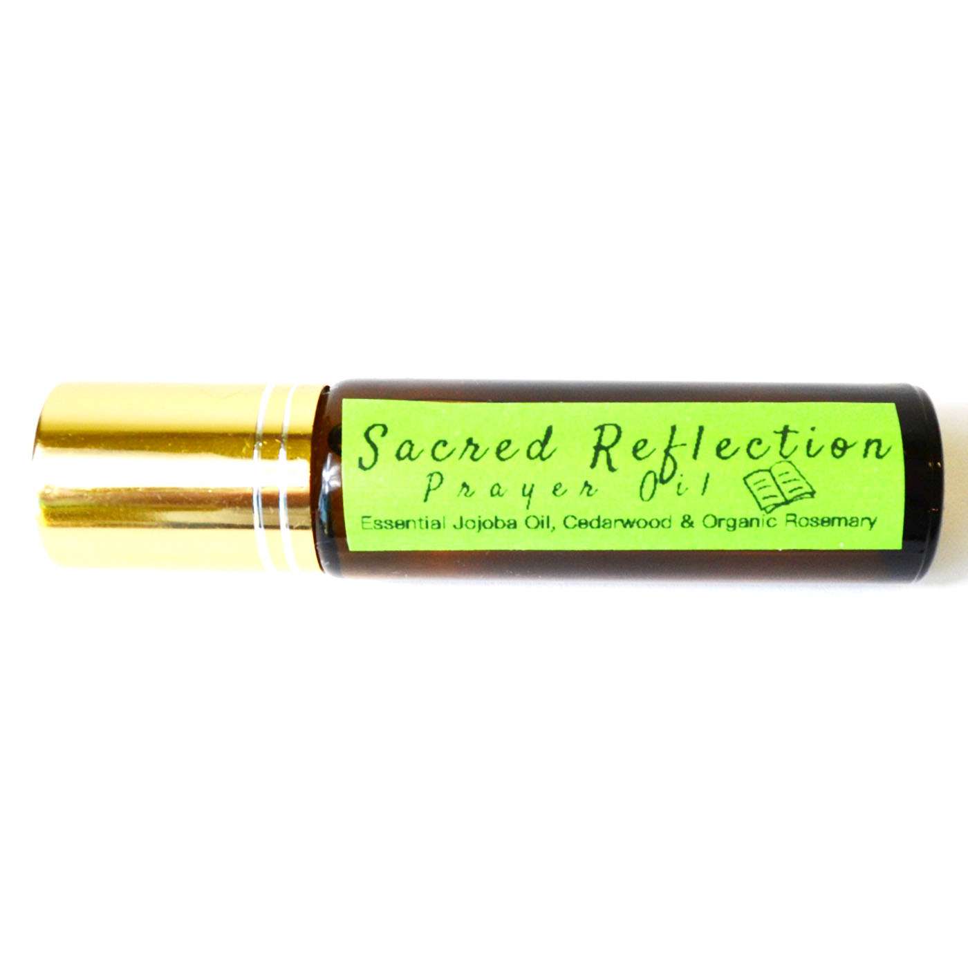 Small 10ml amber glass bottle labeled Sacred Reflection Prayer Oil placed on a plain background.