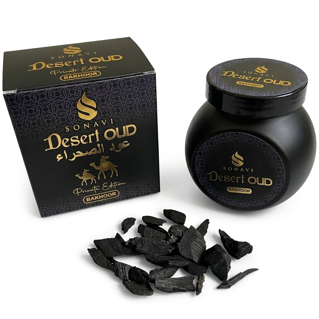 Jar of Sonavi Desert Oud bakhoor incense chips next to its decorative box, with small oud wood pieces scattered around — 40g natural agarwood blend inspired by desert nights.