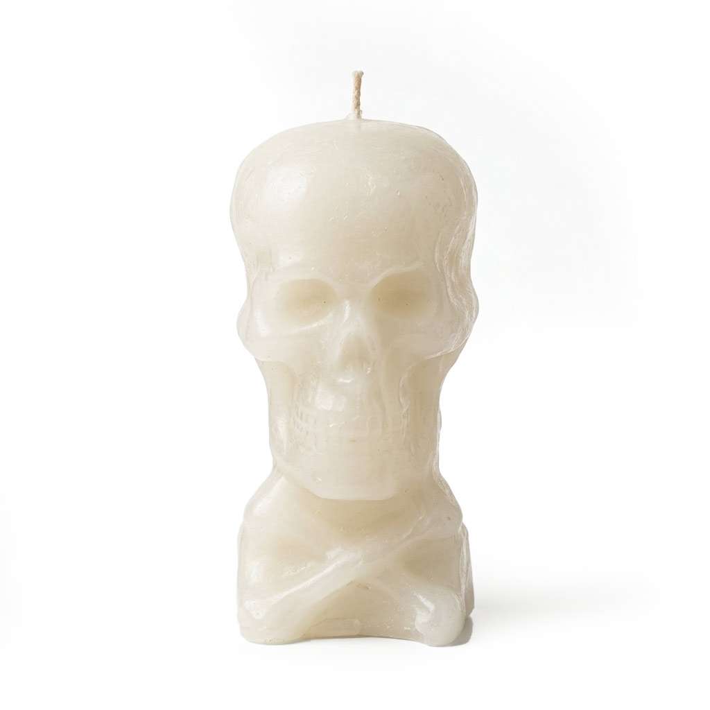 A white skull-shaped candle with a smooth finish and a wick on top. The candle is designed to resemble a human skull, adding a decorative and spooky touch.
