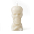 A white skull-shaped candle with a smooth finish and a wick on top. The candle is designed to resemble a human skull, adding a decorative and spooky touch.