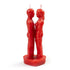 Red wax figure candle 7 inches tall shaped like two standing human figures facing each other, used for hoodoo love spell and romance attraction rituals.
