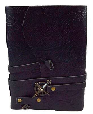 5x7 black genuine leather journal with embossed floral pattern, secured with a decorative cord and compass-style key closure, shown closed on a neutral background.