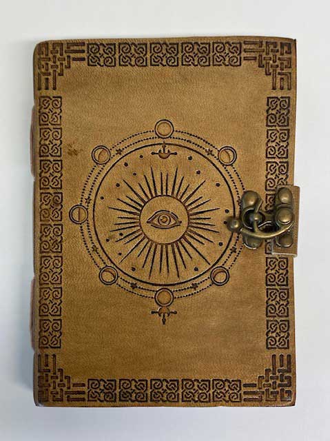 5 by 7 inch moon phase embossed leather journal with latch closure for lunar cycle tracking and ritual notes