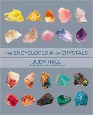 Encyclopedia of Crystals by Judy Hall — large illustrated reference book cover showing colorful gemstone photography for this comprehensive crystal guide.