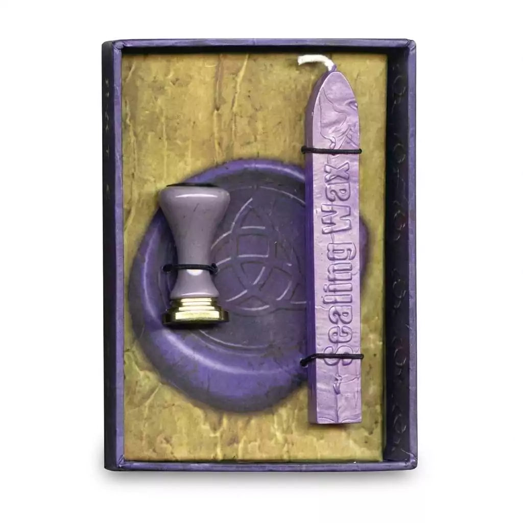 Triquetra sealing wax kit Celtic trinity knot — purple wax stick and triquetra stamp seal presented in decorative box for ritual letter and grimoire sealing.