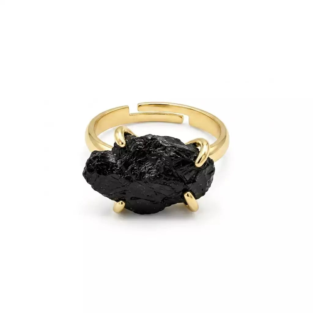 Adjustable black tourmaline ring with rough dark stone set in silver-tone open band, shown on neutral background.