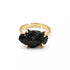 Adjustable black tourmaline ring with rough dark stone set in silver-tone open band, shown on neutral background.
