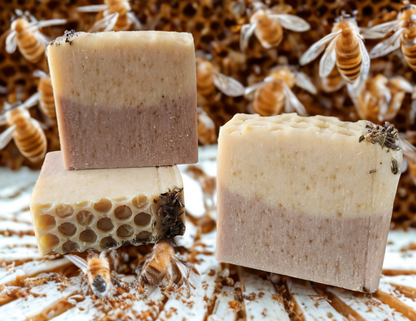 Grounding collection - three lavender and honey soap bars with honeycomb texture and lavender buds on top.