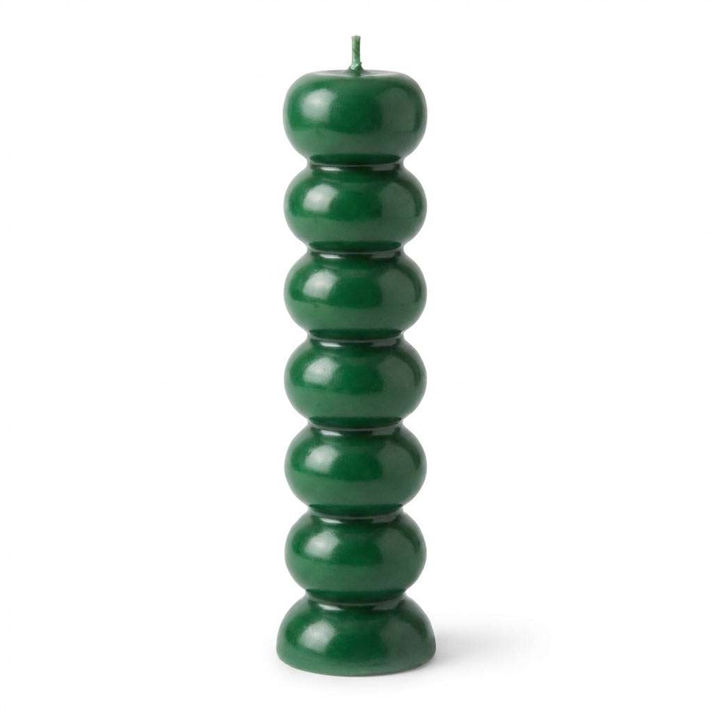 Green seven knob candles for abundance rituals showing seven-segment green wax candle form for weekly intention-setting workings