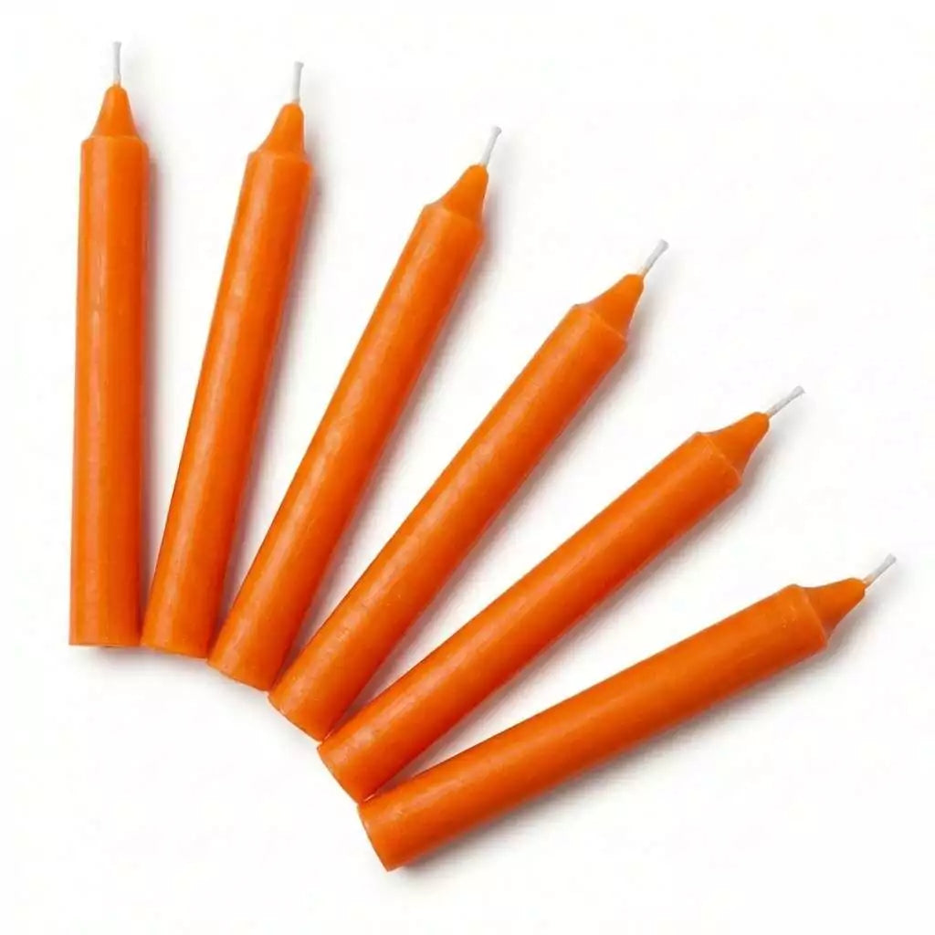 Six orange taper candles arranged in a fan shape, 6-inch household ritual candles for altar and spell work, set of six.