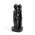 Pair of black figure candles shaped as a man and woman standing back to back on a shared base — 7-inch dual-figure separation candle for cord-cutting rituals.
