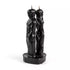 Pair of black figure candles shaped as a man and woman standing back to back on a shared base — 7-inch dual-figure separation candle for cord-cutting rituals.