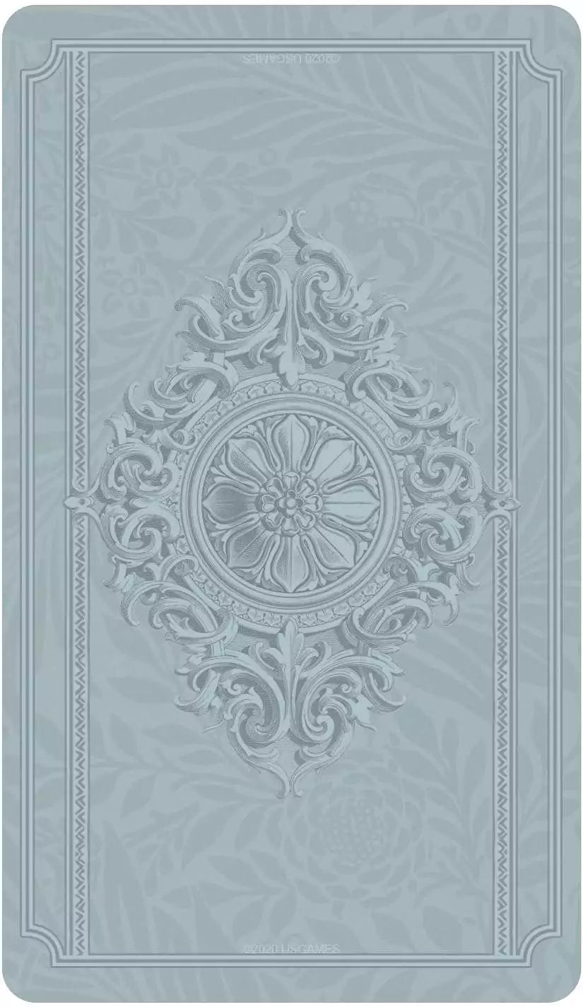Textured embossed card back design in light blue with central floral motif from the Dreamkeepers Tarot deck.