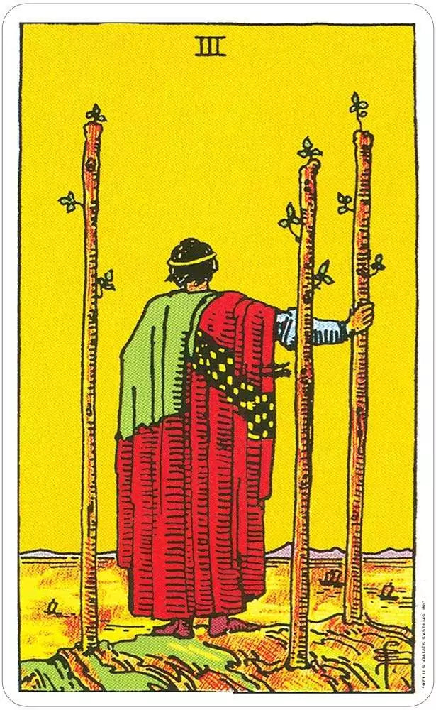 Giant RWS tarot deck spread of Minor Arcana cards on a dark surface — oversized Rider-Waite cards with full illustrated pip scenes.