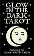 Glow in the Dark Tarot box cover featuring bold white text on black with a stylized moon and face design and scattered stars.