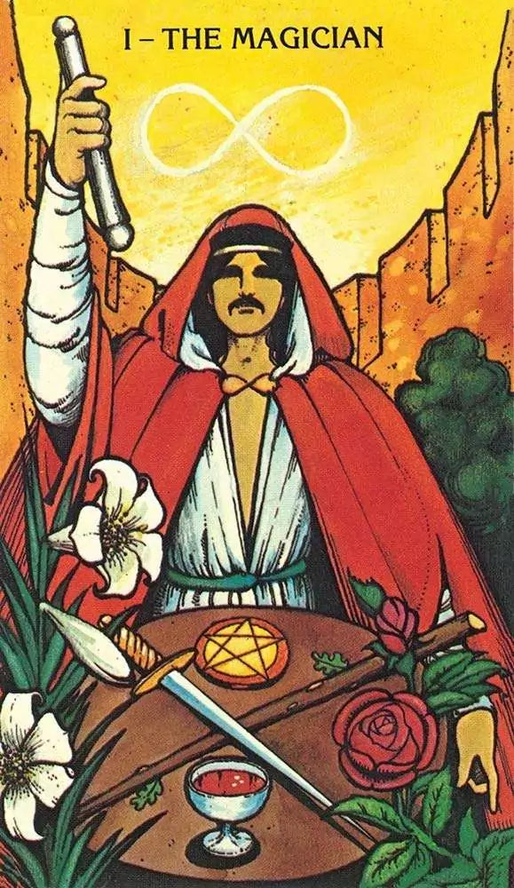Morgan-Greer Tarot Magician card — robed figure holding wand aloft with cup, sword, pentacle, and staff symbols against mountain background.