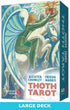 The Thoth Tarot deck box features a vibrant illustration of a winged figure on a horse, holding a cup and surrounded by swirling patterns. The design includes the names of Aleister Crowley and Frieda Harris, along with the deck&