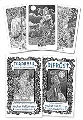 Collection of Yggdrasil Norse Divination Cards showing deities and symbols — intricate pen-and-ink illustrations of Yggdrasil, Bifröst, and Norse mythological figures.