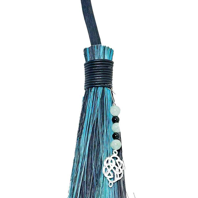 Side view of Celtic black and green besom broom showing traditional broom construction and colors