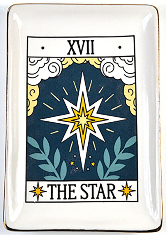 Ceramic dish featuring The Star tarot card motif with a prominent star design, surrounding clouds and foliage, gold edge trim, and tarot card labeling.