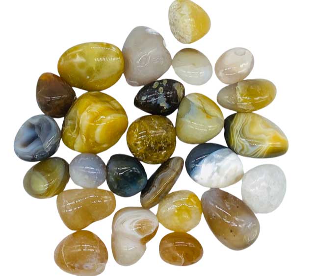 One pound of natural agate polished tumbled stones in assorted earthy tones, for grounding crystal grids, altar display, and bulk crystal apothecary supply.