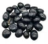 1 lb agni manitite black tumbled tektite stones in 20-22mm size showing smooth polished meteorite-origin surface — Java Indonesia bulk crystal.