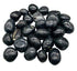 1 lb agni manitite black tumbled tektite stones in 20-22mm size showing smooth polished meteorite-origin surface — Java Indonesia bulk crystal.