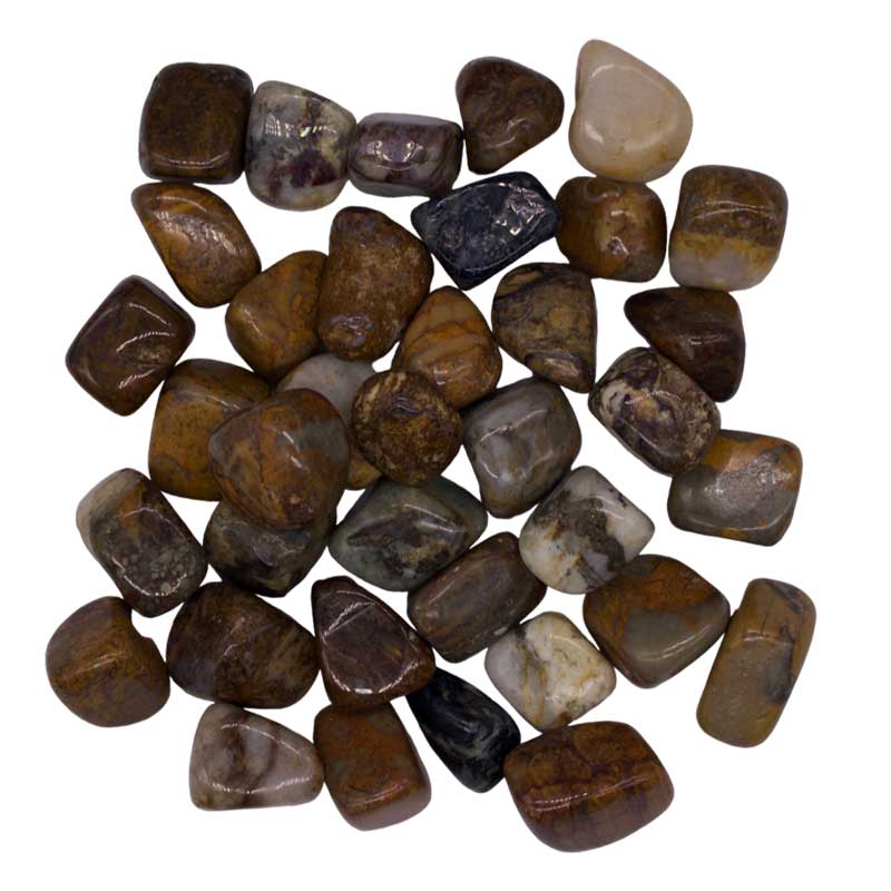 Pile of polished pietersite tumbled stones in swirling blue and gold chatoyant patterns, one pound bulk lot on white surface