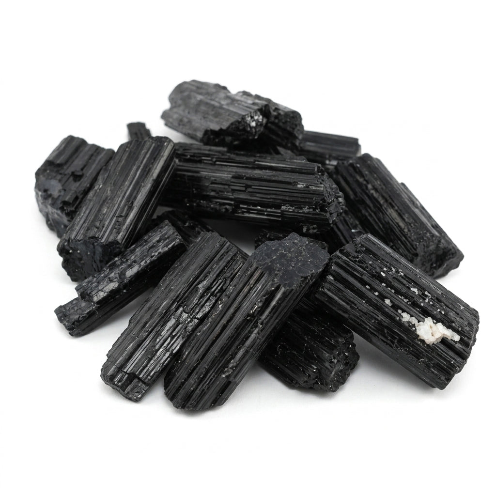 Large raw black tourmaline schorl stones in bulk — natural rough dark crystal pieces for protection grids and grounding practice.