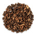 White oak bark dried herb showing finely chopped brown herbal material in a small pile on white background