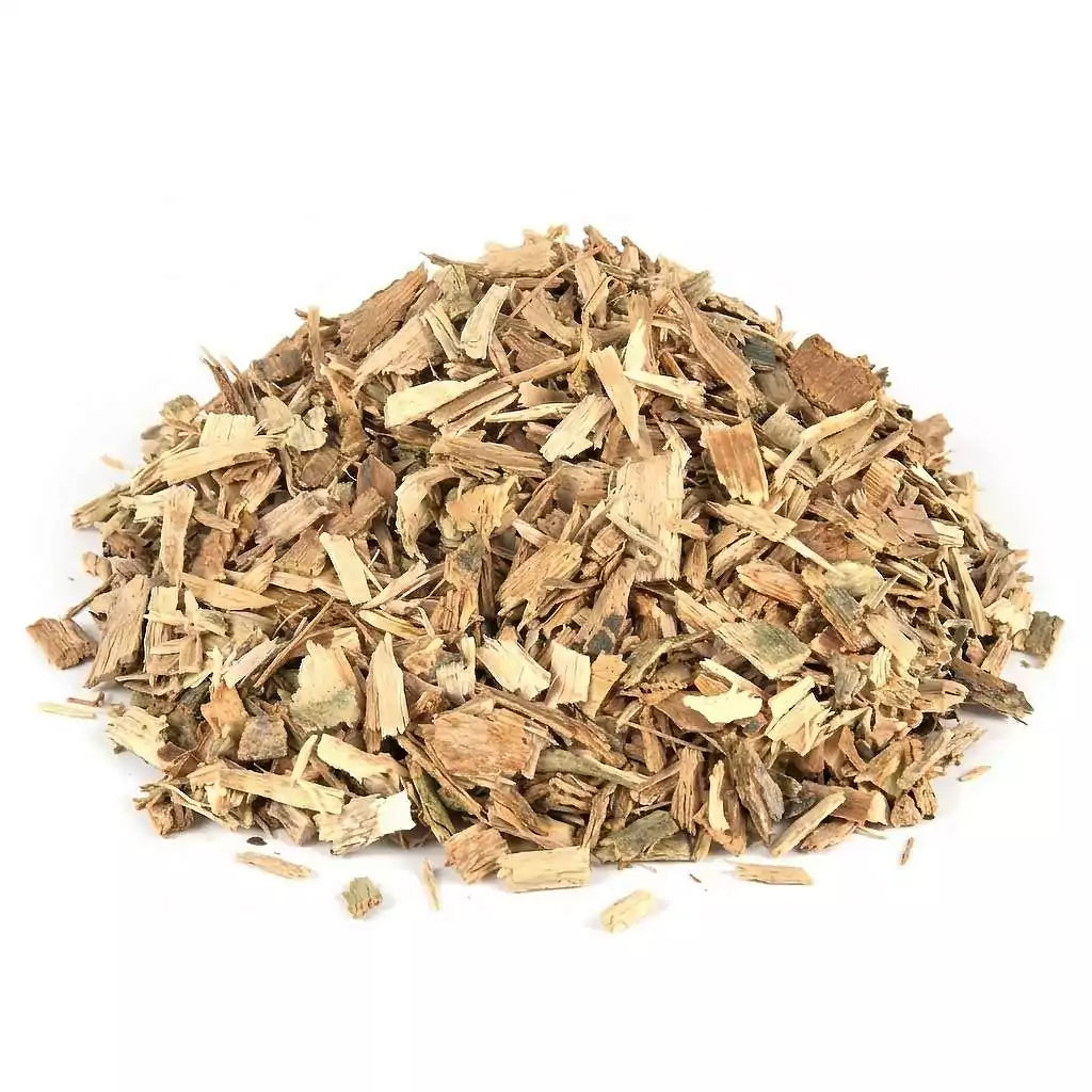 Dried white willow bark cut herb showing natural brown fibrous texture of Salix alba bark pieces in a small pile