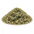 Dried wormwood (Artemisia absinthium) cut herb in a pile showing finely chopped green herb texture, ritual botanical ingredient