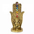 Gold-tone decorative hand incense burner with colorful chakra gemstones along the center and a small Ganesha figurine at the base.
