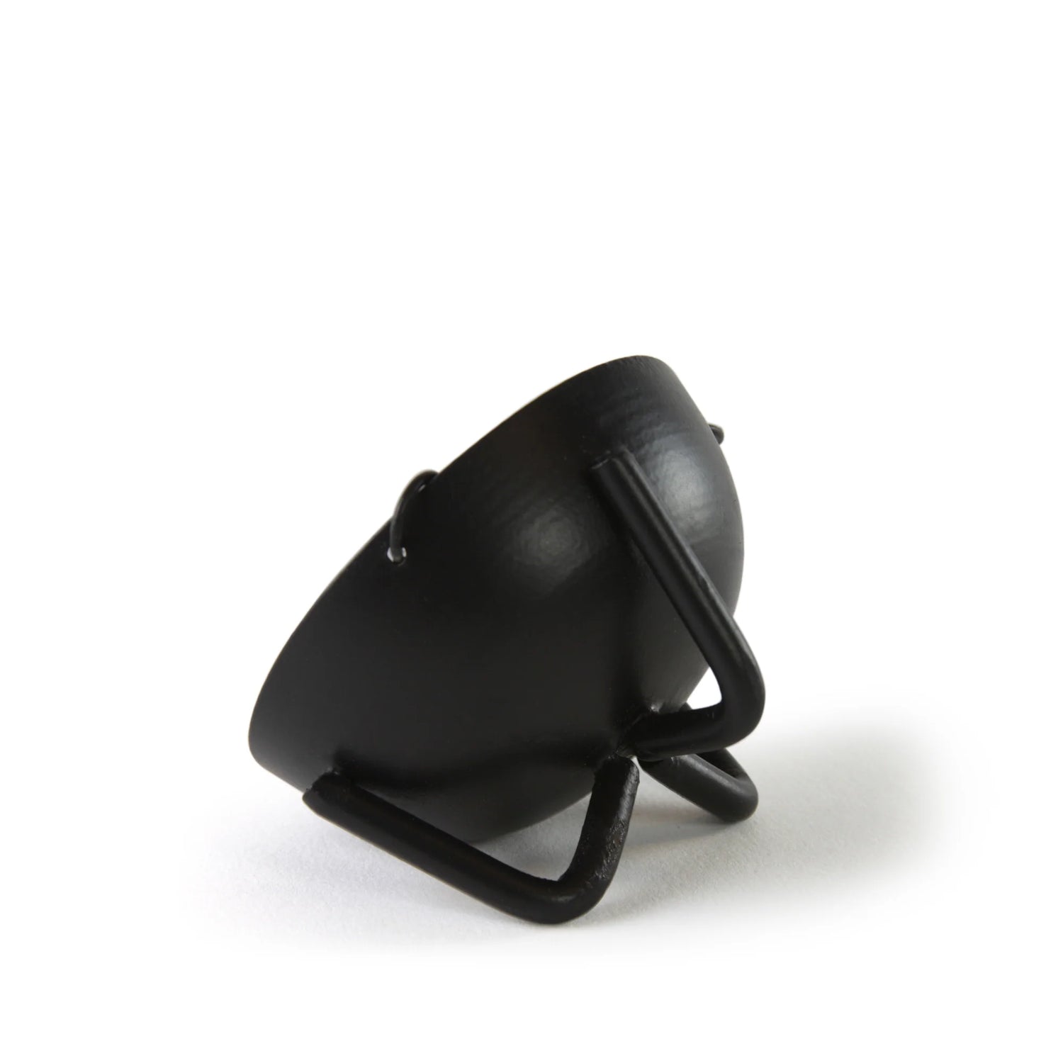 Black curved iron incense burner piece on a stand showing simple modern profile of the hanging bowl support arm.