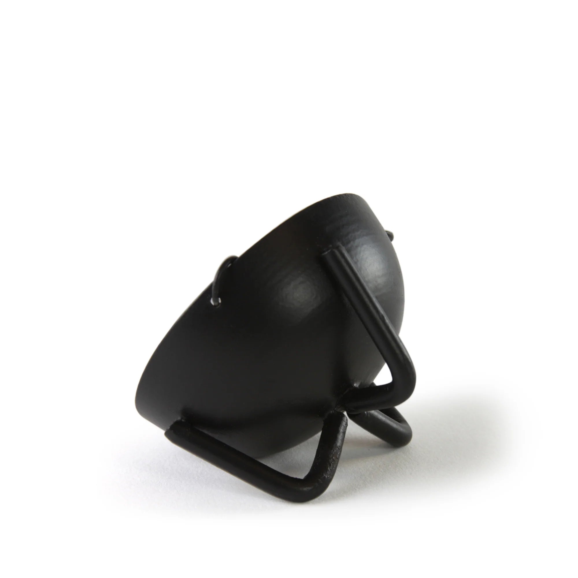 Black curved iron incense burner piece on a stand showing simple modern profile of the hanging bowl support arm.