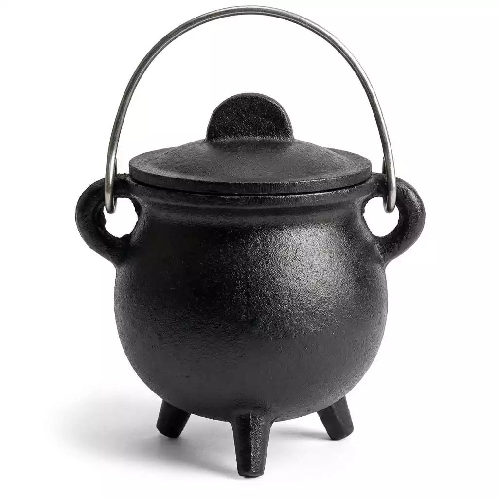 3-inch plain cast iron cauldron with fitted lid, used as a ritual burning vessel for herbs, resin incense, and loose charcoal on the altar.