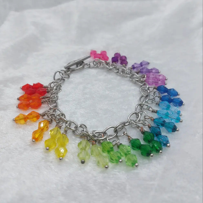 Stainless steel bracelet with colorful rainbow bicone plastic beads, approximately 8 inches long.