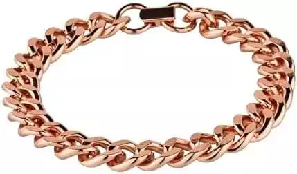 Solid copper heavy chain bracelet with interlocking links close-up — bold rose-gold toned copper healing jewelry displayed on surface.