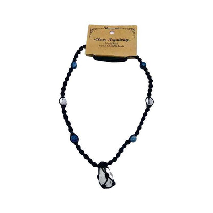 Harmonia beaded necklace with mixed colored beads and a central crystal pendant displayed on a card describing its clearing purpose.