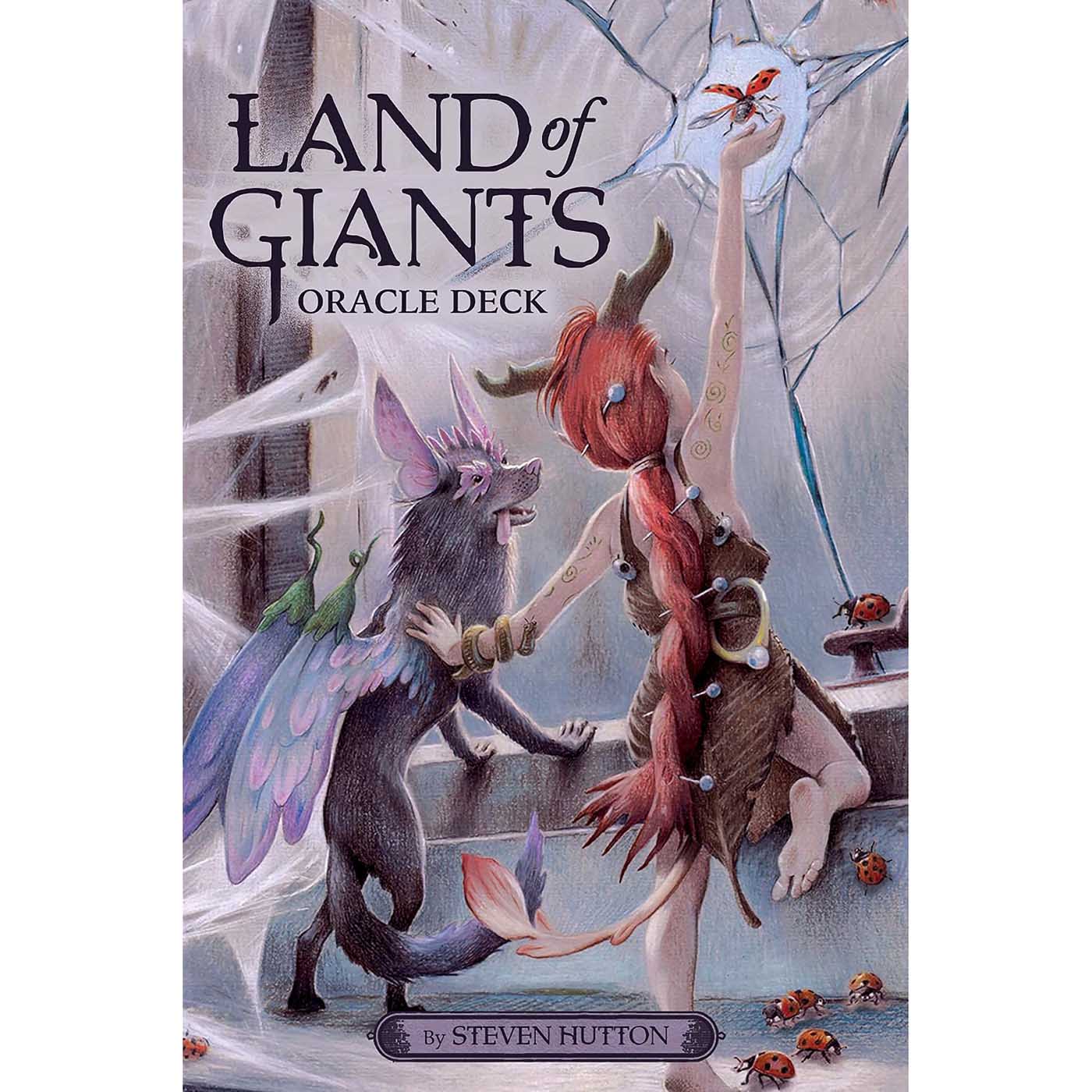 Land of Giants Oracle deck cover showing two small fairy folk, one with wings, in an abandoned manor with spider webs and ladybugs, one reaching toward a butterfly against a cracked window, by Steven Hutton.