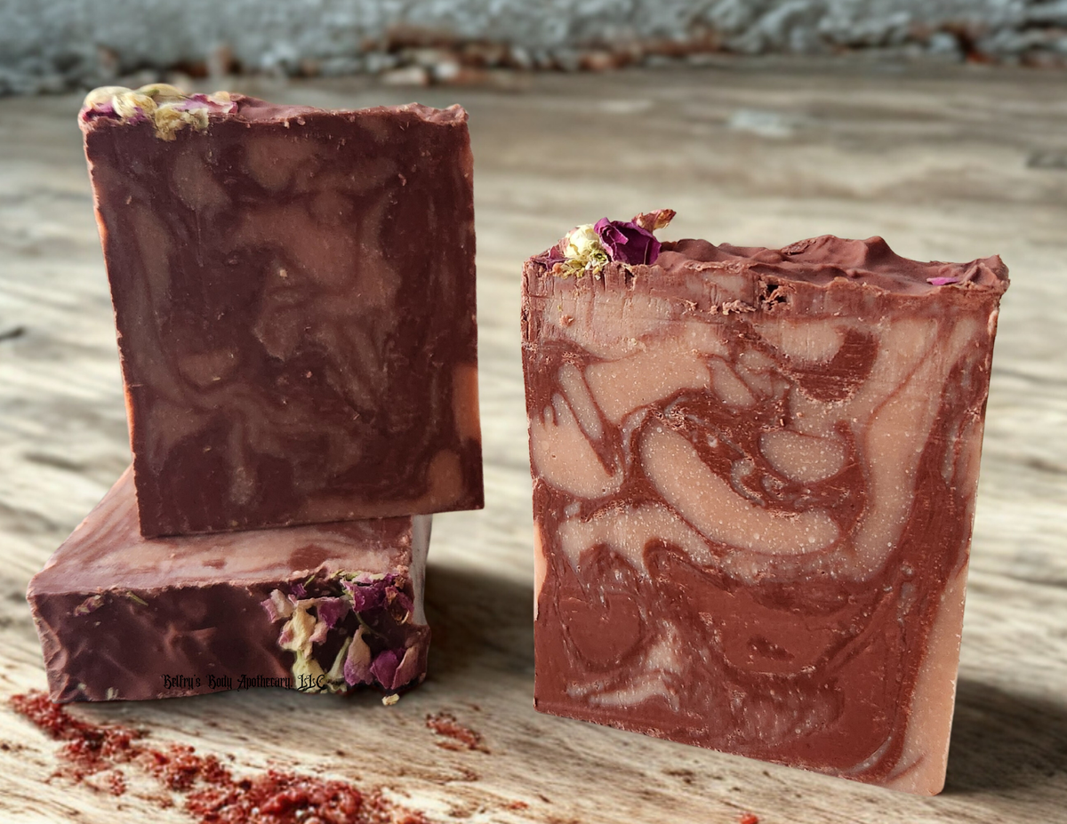 Protection collection - three red Moroccan  and French pink clay soap bars with florals on top.