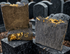 Cleansing collection - Three activated charcoal salt soap bars with yellow calendula petals on top.