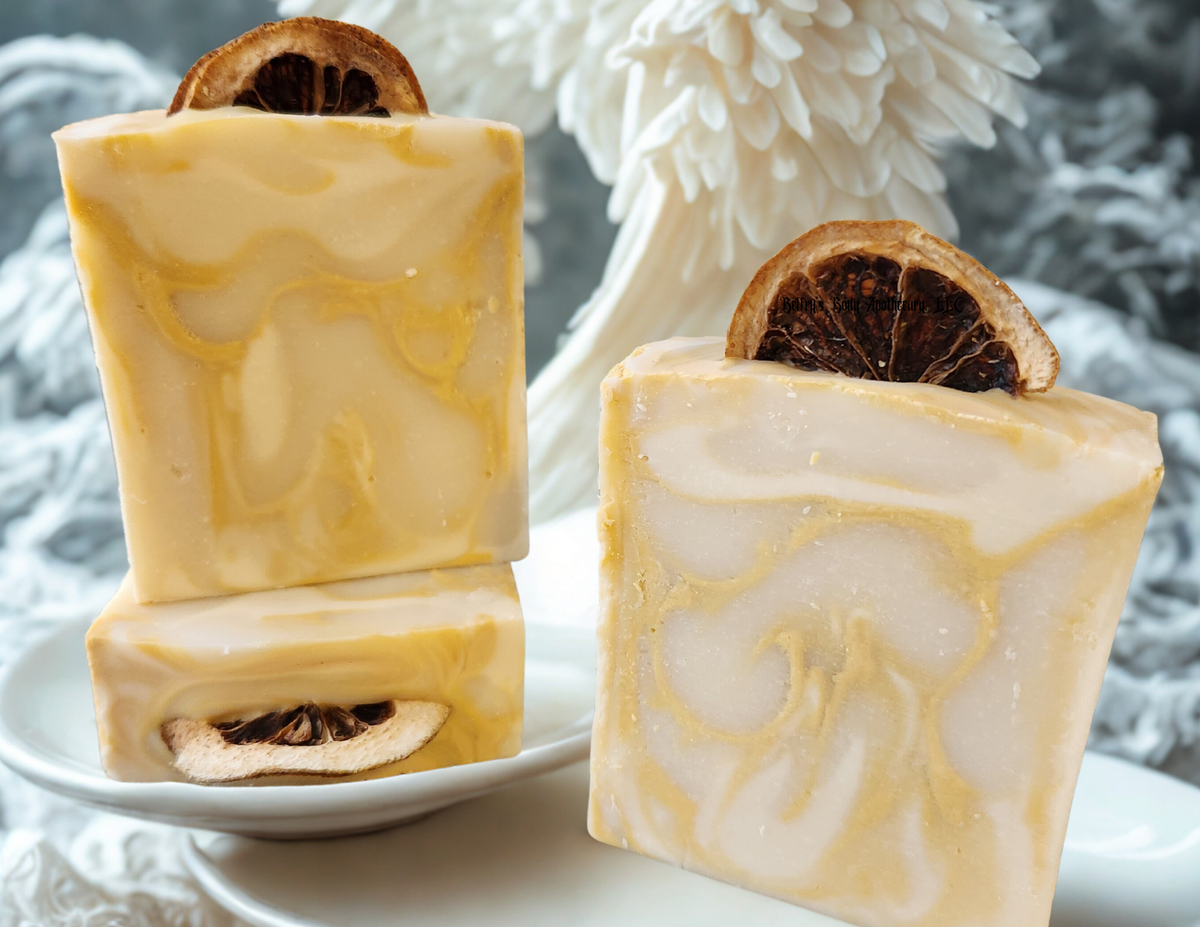 Protection collection - three white kaolin clay and Brazilian yellow clay soap bars with dehydrated lime slices on top.