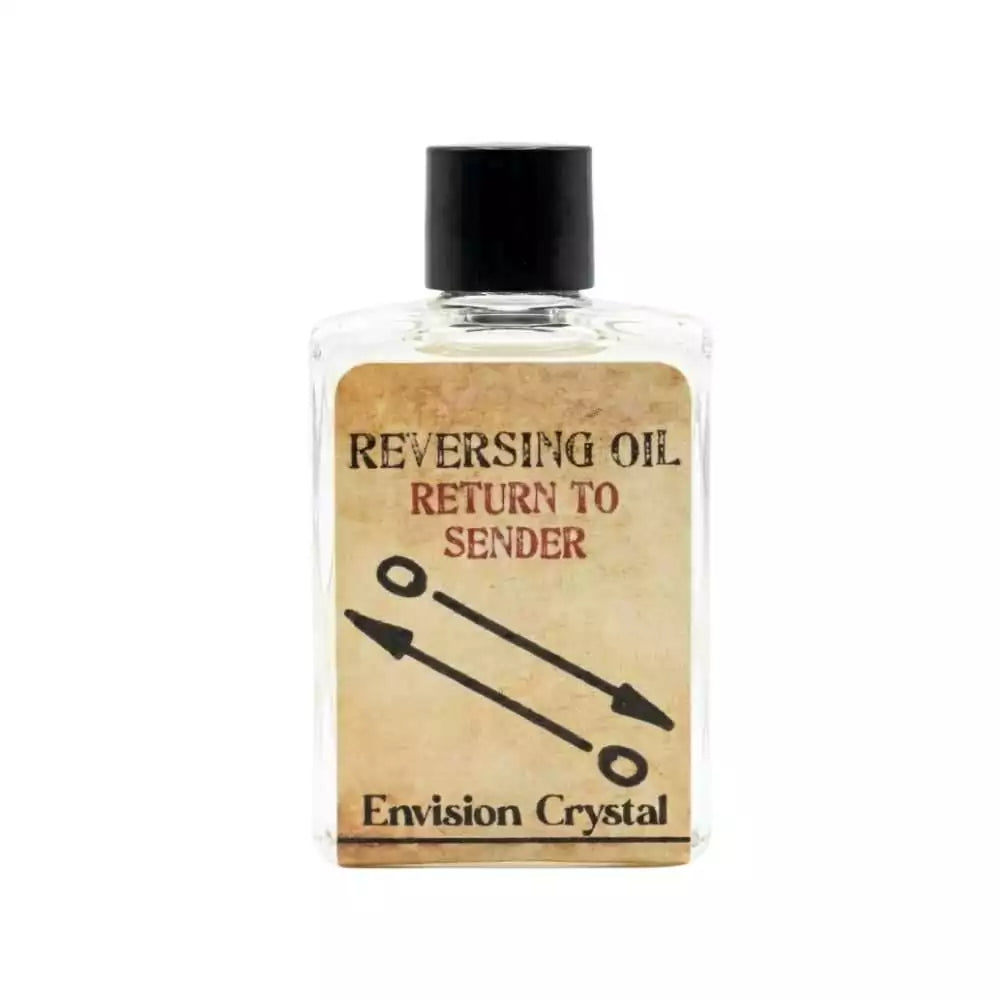 Clear bottle of Reversing / Return to Sender ritual oil by Envision Crystal — arrow imagery label indicating reversal purpose for reflecting negative energy.