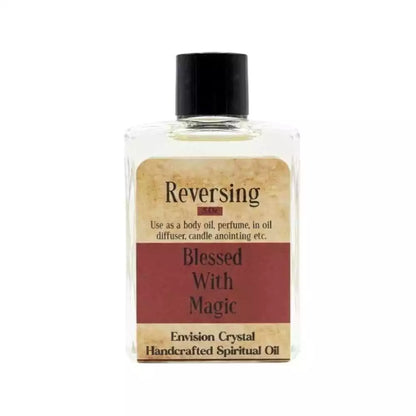 Clear bottle of Reversing ritual oil with Blessed With Magic label — Envision Crystal body oil for sovereignty and returning negative energy to sender.
