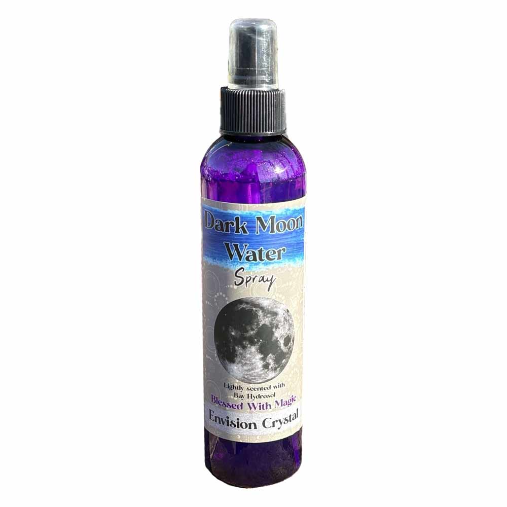 A purple spray bottle labeled "Lunar Moon Water Spray," featuring a moon graphic and text about its use with crystals.