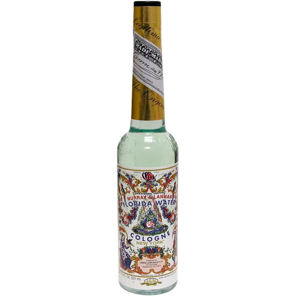 Murray and Lanman Florida Water 7.5 oz original cologne bottle — decorative label with intricate floral and citrus design for spiritual ritual use.