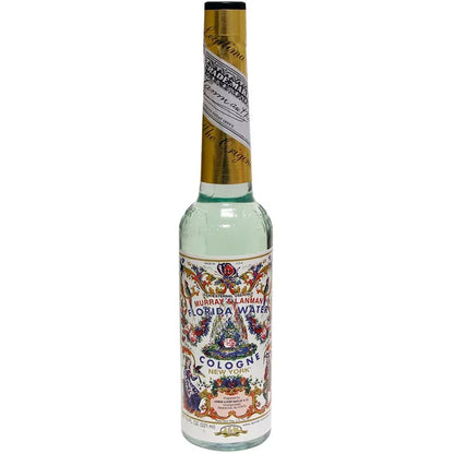 Murray and Lanman Florida Water 7.5 oz original cologne bottle — decorative label with intricate floral and citrus design for spiritual ritual use.