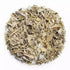 Round pile of herbal blend with pale green leaves and white crystals.